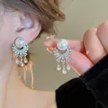 Elegant silver-plated pearl earrings with sparkling crystal tassels and flower accents. - 56# Silver Needle - Silver - White Circular Tassel