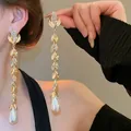 Elegant gold leaf tassel earrings with rhinestones and teardrop pearls in vintage style - 77# Silver Needle - Golden Teardrop Tassel