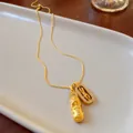 Gold Pixiu and Vajra pendant necklace with crystal accents on an elegant ceramic tray - Auspicious Beast Lucky Cloud Double Pendant (7# Necklace-Real Gold Plating)