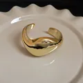 Minimalist gold-plated sculptural open cuff bracelet with irregular fluid artistic design - Gold Twisted Bangle