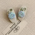 Elegant oval linen hair clips with blue floral embroidery, perfect for a vintage look. - 26# Duckbill Clip - White Single Embroidery