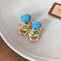 French retro style gold-tone earrings featuring turquoise stones and green crystal accents - Earrings (HN4775) / Silver Needle / Gold and Teal