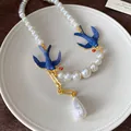 Elegant vintage French style pearl necklace with blue enamel swallows and baroque pearl. - Necklace (HN4775) / Gold with Blue White