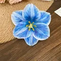 Elegant blue fabric flower hair clip featuring realistic yellow center for women - 51 Duckbill Clip - Blue