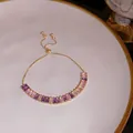 Elegant adjustable gold bracelet featuring vibrant purple and pink rectangular zircons. - 1# Bracelet