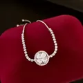 Elegant silver adjustable bracelet with sparkling zircon clover pendant on red velvet stand - 22# Bracelet (Round Four-Leaf Clover)