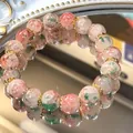 Elegante bracciale in perle di vetro crackle con motivi marmorizzati rosa e verdi - Perle Tonde Effetto Crepa Sfumate / Sfumatura Rosso Verde