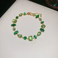 Elegant Korean style gold-tone bracelet with geometric green zircons in various cuts. - 12# Bracelet (Green Geometric)