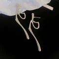 Irregular silver metal tassel drop earrings for women with minimalist fashion design - Style 63# Silver Earring Post Silver Intertwined Rings