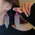 Elegant long pink rhinestone tassel earrings with a sparkling fringe and silver needles - Gradient V-shaped Tassel Style / Gold-Purple Triangle
