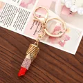 Fashionable gold-tone rhinestone lipstick keychain bag charm with bright red tip accent - Pink Rhinestone Inlaid Lipstick Shape / Pink