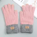 Warm pink and gray knit winter gloves with touchscreen fingertips and a decorative label - Pink
