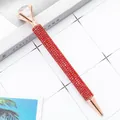 Elegant rose gold ballpoint pen decorated with red rhinestones and a large top crystal - 1.0mm Bullet Tip / Red