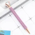 Elegant rose gold ballpoint pen with purple rhinestones and large crystal diamond top. - 1.0mm Bullet Tip / Light Pink