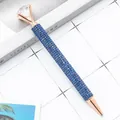 Elegant rose gold diamond ballpoint pen with blue rhinestones on white grid surface - 1.0mm Bullet Tip / Blue