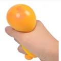 Hand squeezing a yellow TPR flour stress ball toy for decompression and anxiety relief. - Yellow Color Liquid Ball