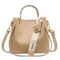 Elegant tan large capacity bucket bag for women with a unique decorative fashion strap - Khaki