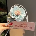 Elegant light blue artificial flower ballpoint pen decoration in clear gift bag packaging - Camellia Pen (Ice Blue)