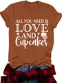 Detail of women's terracotta t-shirt with 'Love and Cupcakes' white graphic print. - Rusty Red