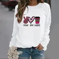 Women's loose white long-sleeve sweatshirt featuring stylish Peace Love Coffee graphic print - S / White