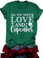 Close-up of women's dark green t-shirt with All You Need Is Love and Cupcakes graphic print - Wheat Green