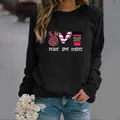Women's black long sleeve sweatshirt featuring Peace Love Coffee leopard graphics - S / Black