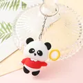 Close-up detail of a cute cartoon panda keychain with a red shirt and yellow racket - Sport Panda - Racket