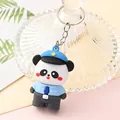 Macro detail of a cute panda cartoon keychain wearing a blue police officer uniform. - Police Panda B