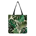 Detailed view of tropical green leaf print on canvas tote bag with black straps - Summer Vacation Tropical Print Style (hm4796)