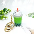 Cute cat bubble tea cup keychain with green liquid and golden ring - Regular Cat Green
