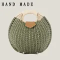 Elegant round woven paper rope shell handbag in olive green featuring a beige top handle - Standard Type / Army Green