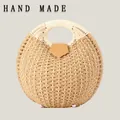 Handmade round straw woven handbag with circular cream handle and brown leather clasp - Upgraded Handle / Camel
