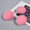Three pink brain-shaped squishy stress relief toys with realistic anatomical texture - Small Brain / Pink