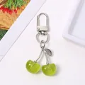 Cute green glitter resin cherry keychain with silver-toned clasp for bags - Green