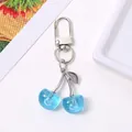Sparkling blue resin cherry keychain with silver metal clip for handbags and keys - Lake Blue