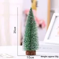 Detailed close-up of a 25cm frosted mini Christmas tree on a rustic wooden base - 25cm