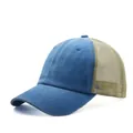 Distressed washed cotton trucker hat with blue front panels and breathable khaki mesh. - Lake Blue