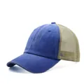 Close-up of distressed blue washed cotton trucker hat with beige mesh back - Adjustable / Blue