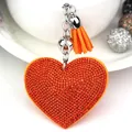 Elegant sparkling orange heart rhinestone keychain with a matching leather tassel - Silver + Orange