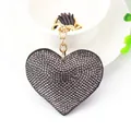 Elegant heart-shaped leather keychain with grey rhinestones and tassel charm - Gold Tone + Grey
