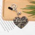 Glamorous leopard print rhinestone heart keychain with black tassel and silver ball charm - Silver + Khaki Leopard