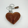 Brown heart-shaped rhinestone keychain with matching tassel and silver metal clip - Brown