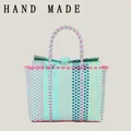 Handmade colorful woven plastic tote bag for beach vacations and picnic outings - Tiffany Green