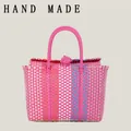 Handmade colorful woven plastic basket bag for beach and picnic in vibrant pink color - Rose Red