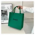 Minimalist vibrant green felt tote bag with merci slogan print for women daily use - 23*23*13cm / Green