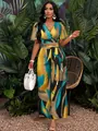 Full-length view of a women's tropical print set featuring butterfly sleeves and wide-leg pants - S / Top And Bottom / Rainbow