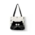 Linen tote bag featuring a cute black cat cartoon print with splattered heart detail. - 34*38 / Black and White Cartoon Cat Eyes (10)