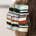 Unique acrylic hair claw clip shaped like a stack of books for back to school fashion. - Brown Book Style