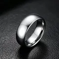 Close-up of polished 316L stainless steel band ring on black leather background - US 5 / 8mm Plain / Steel