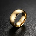 Close-up detail of a 6mm gold polished titanium steel ring with smooth arc design - US 5 / 8mm Plain / Gold